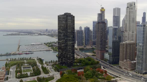 Aerial of high-rise towers, busy street and Lake Michigan in Chicago