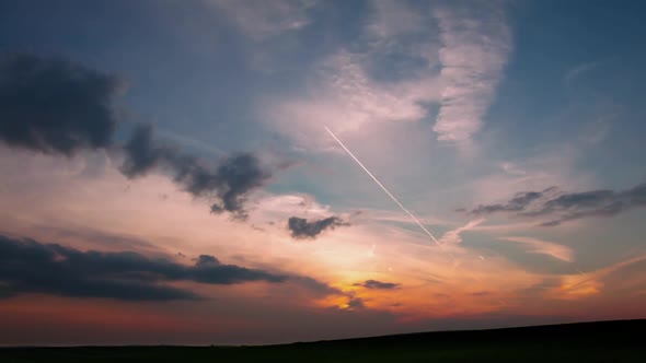 Clouds and Traces of Planes on Sunset