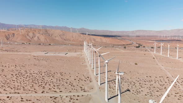 Drone towards Palm Springs Energy Windmill Farm in the Desert of California