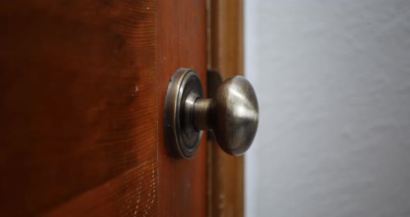 Cleaning and sanitizing a door knob covered in bacteria and corona virus with a disinfecting antibac