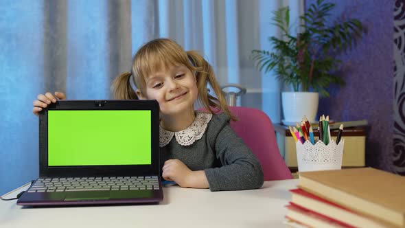 Child Girl Studying Elearning Distance Education Kid Pointing at Laptop Green Screen Chroma Key