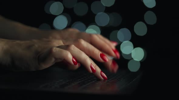 Accelerated Video of Female Hands is Typing on a Laptop at Night