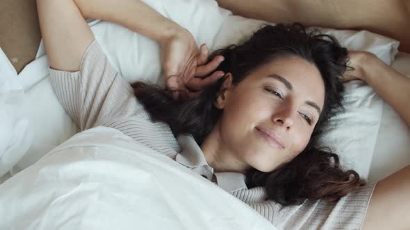 Caucasian Woman Posing Lying in Bed