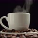 Hot coffee. Coffee cup and coffee beans. Hot ceramic coffee cup with smoke - VideoHive Item for Sale