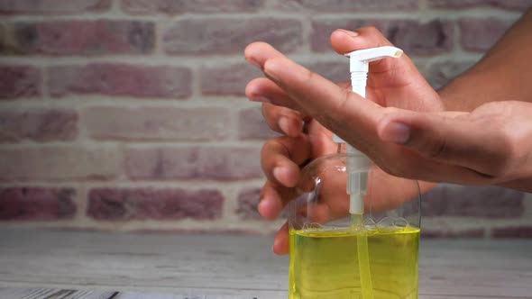 Young Man Hand Using Sanitizer for Preventing Virus 