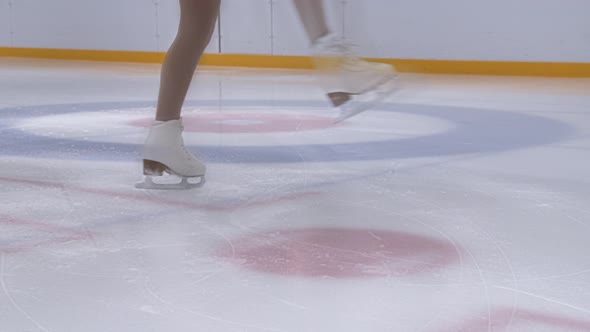 Young Ice Skater Spinning On Ice Rink