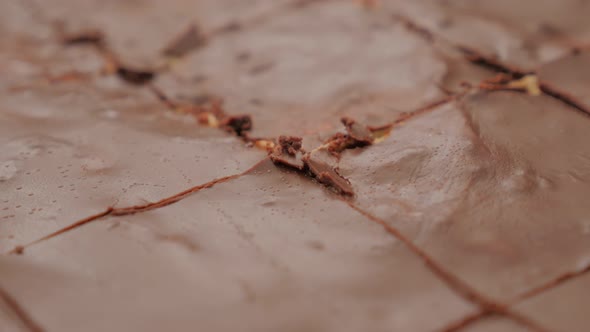 Tasty glazed chocolate cake parts slow tilt 4K 2160p 30fps UltraHD footage - Slow tilting  over cake