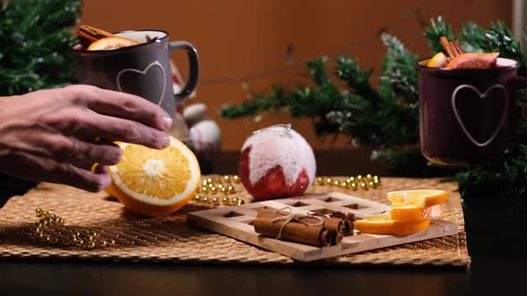 Couple Clinking Mugs with Mulled Wine