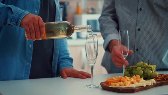 Young Man Pouring Wine