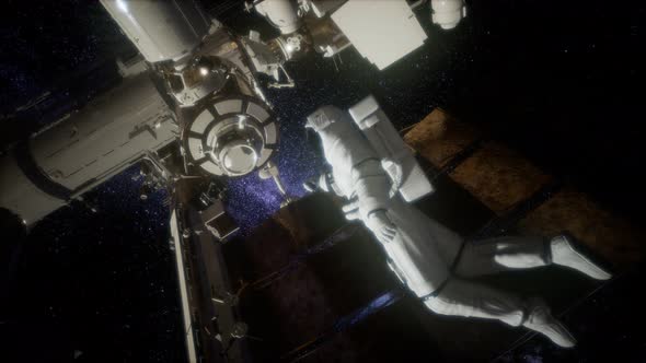 Astronaut Outside the International Space Station on a Spacewalk alt