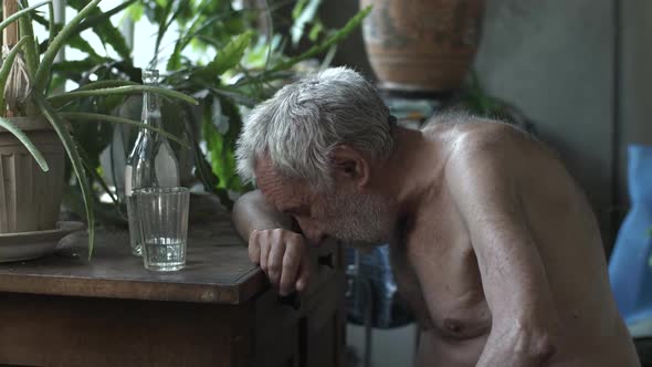 Drunk Old Man Sleeping at the Table