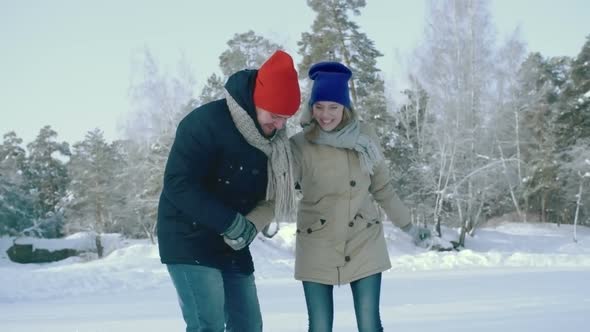 Young Couple Learning How to Ice Skate