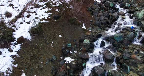 Drone shots of stream and small waterfalls created by melting snow in Troodos Mountain Cyprus.
