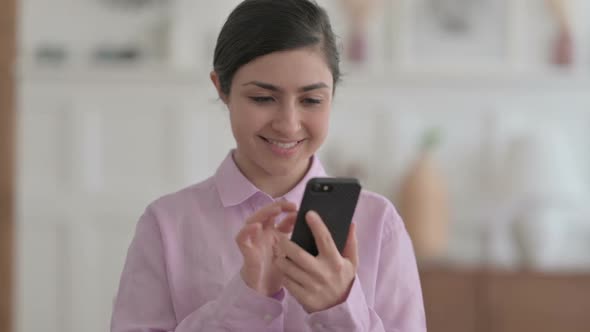 Portrait of Indian Woman using Smartphone