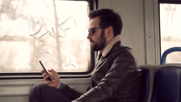 Man Using Smartphone For Online Shopping. Remote Working Public Transport. Sending Message.