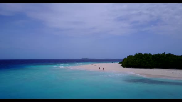 Aerial above panorama of paradise coastline beach lifestyle by turquoise water with white sandy back