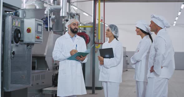 Food Industry Engineer Man Holding a Tablet in