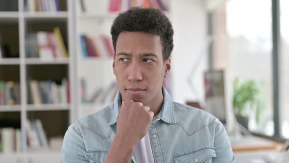 Pensive Young African American Man Thinking Idea Brainstorming