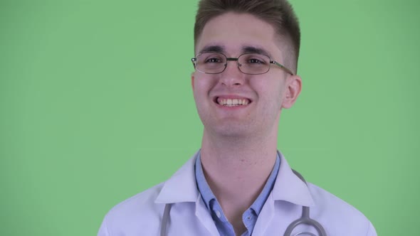 Face of Happy Young Man Doctor Thinking