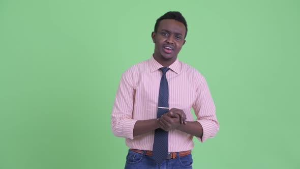Happy Young African Businessman Vlogging and Talking To Camera