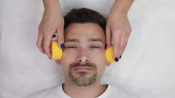 Beautician Washes Male Face