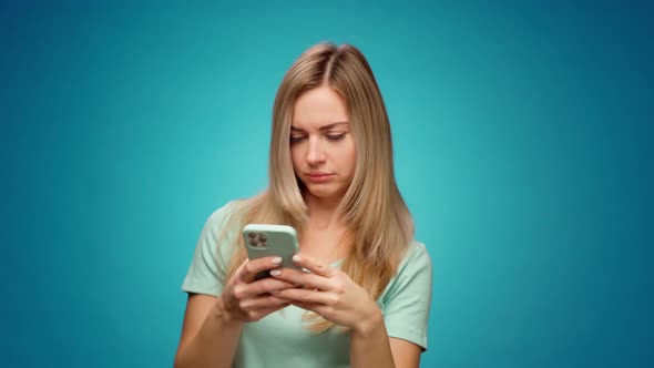 Young Woman Using Her Smartphone in Studio