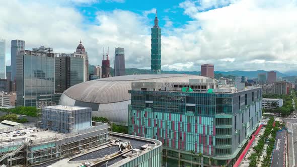 Ascending aerial view of over city of Taipei, with 101 Tower, futuristic buildings and Dome - Beauti