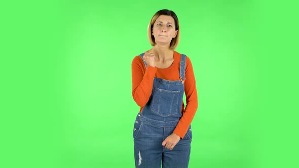 Girl Threatens with a Fist. Green Screen