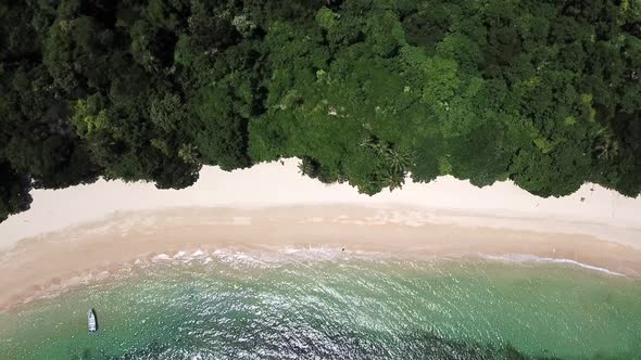 A Drone clip from above at an empty Tropical Beach called Pasir Panjang on Kapas Island, Malaysia ea