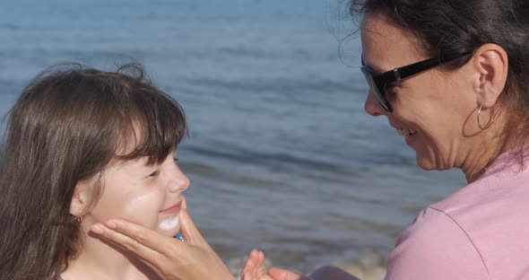 Child with Sunblock on Beach