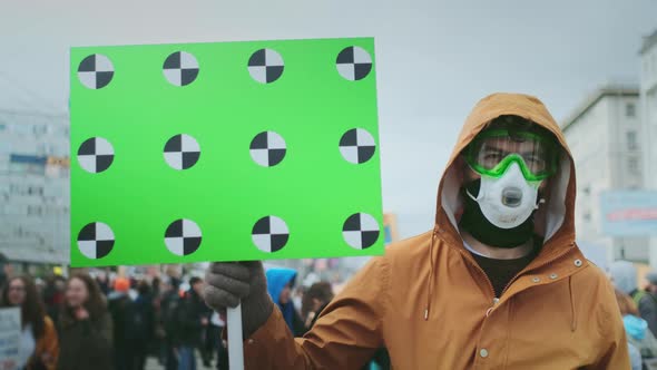 Gasmask Rebel Face Portrait. Anger Man Hold Banner in Hand. Gas Mask Resistance