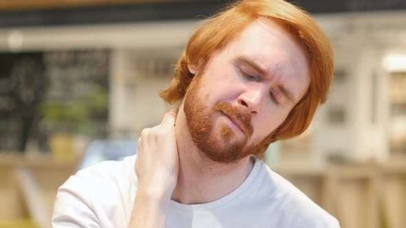 Redhead Beard Man with Serious Neck Pain, Indoor