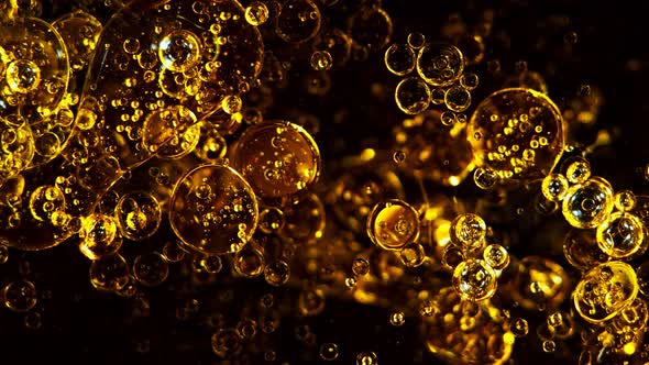 Super Slow Motion Shot of Moving Oil Bubbles Isolated on Black Background at 1000Fps