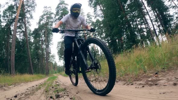 Professional Cyclist Is Riding a Bmx Through the Forest