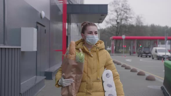 Young Woman with Purchases From the Supermarket