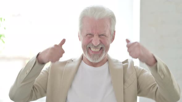 Portrait of Excited Old Man Celebrating Success
