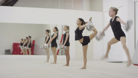 Girls Performing Cheerleading Moves