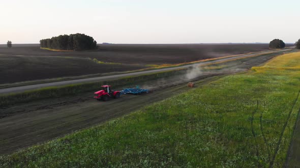 Plowing the soil near  rural road