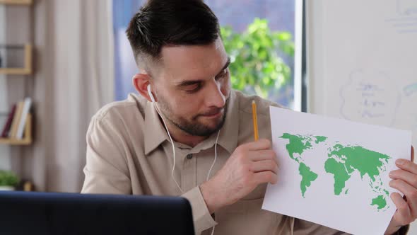 Teacher with World Map Having Online Class at Home