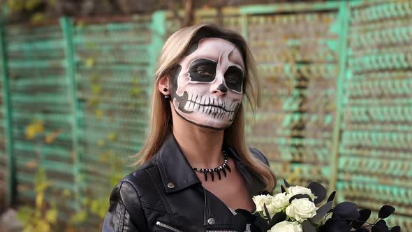 Close-up Portrait of a Gothic Girl in a Wedding Dress and a Creepy Make-up