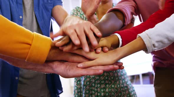 Group of business executives with hand stack