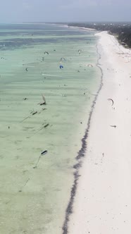 Vertical Video Kitesurfing Near the Shore of Zanzibar Tanzania