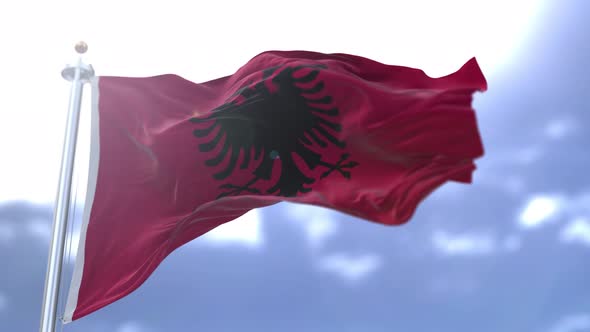 Albania flag of Algeria waving in slow motion