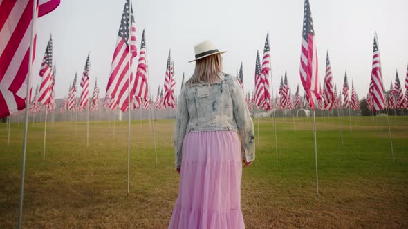 Camera Following Young Woman Walking By September 11Th Memorial Display Malibu