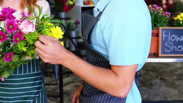 Florists checking bunch of flower