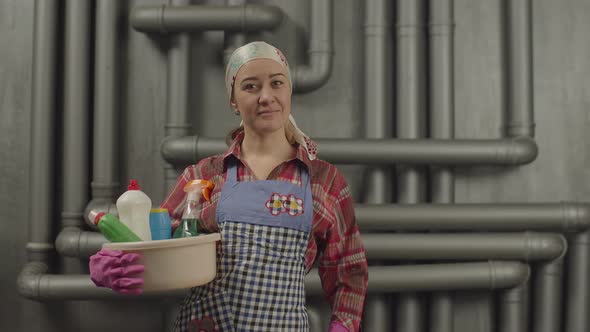 Woman with Cleaning Supplies Gesturing Happily