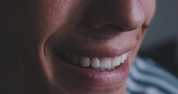 Close up shot of mouth while smiling and talking