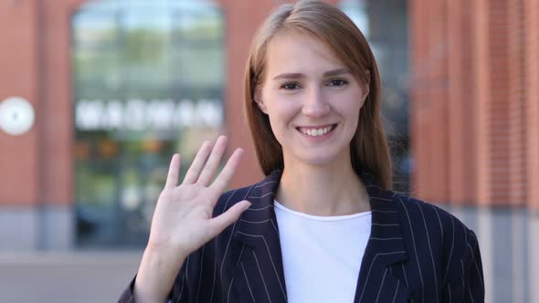 Hello Sign by Young Businesswoman