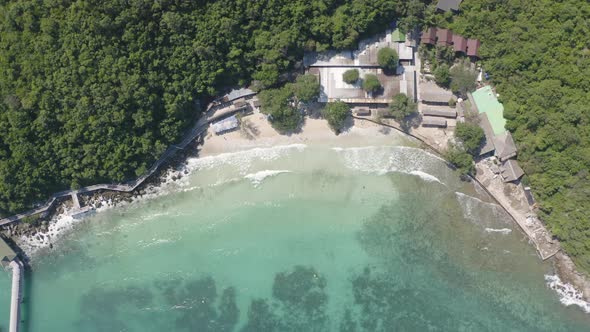 Aerial view of Koh Larn beach, Pattaya with blue turquoise seawater, mountain hills,