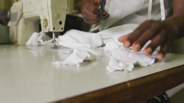 African man cutting tissue